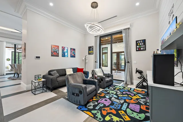 a view of a park and trees with wooden fence