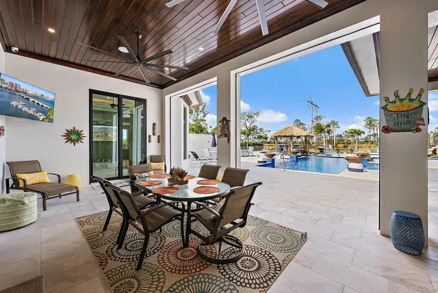 a front view of a house with swimming pool and porch