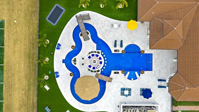 a living room with furniture fireplace and a large window