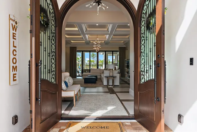 a kitchen with stainless steel appliances kitchen island granite countertop a stove and a refrigerator