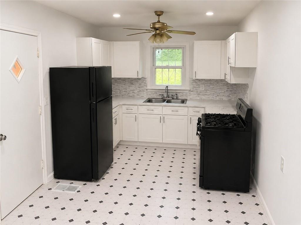 1189 Rock Cut Road Forest Park, GA 30297 - Photo 14 of 23 a kitchen with a refrigerator and a stove