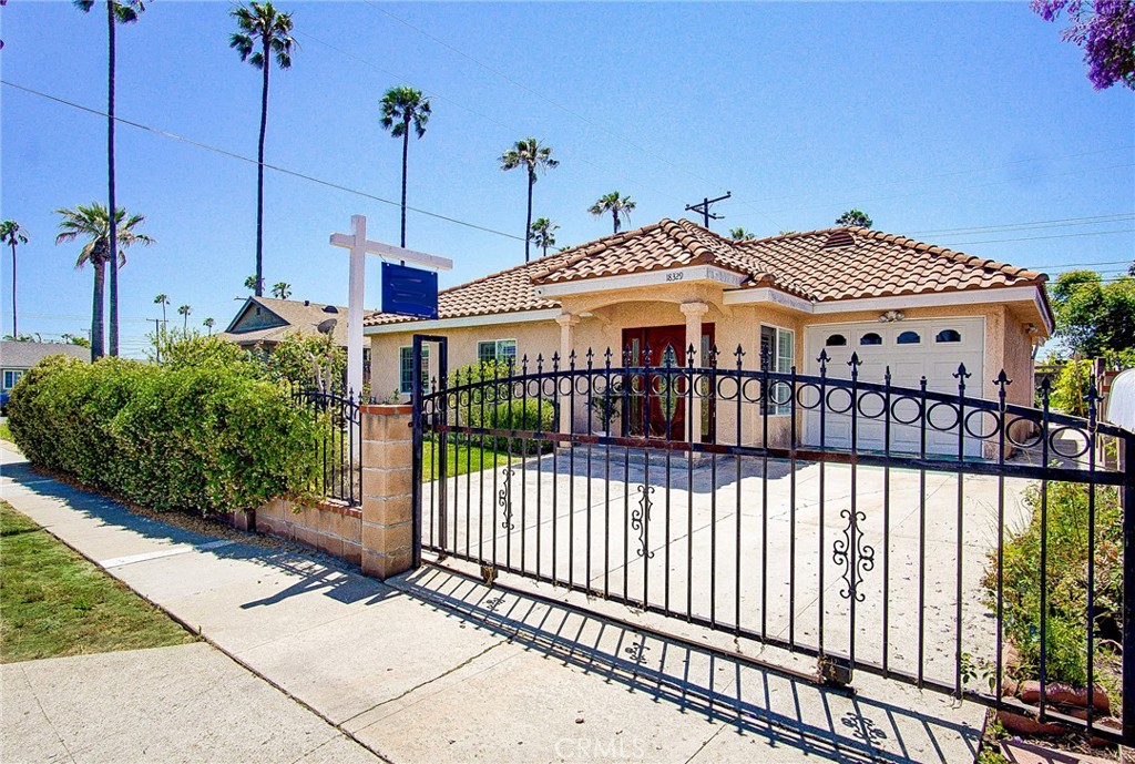 18329 Ambler Avenue Carson, CA 90746 - Photo 1 of 33 a front view of a house with a garden