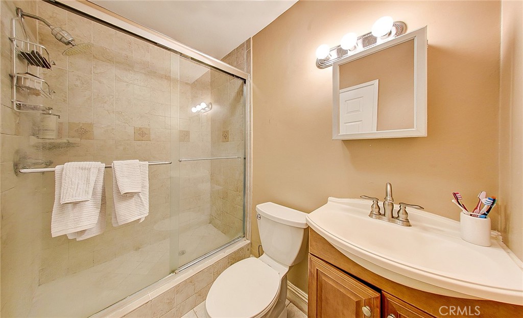 18329 Ambler Avenue Carson, CA 90746 - Photo 19 of 33 a bathroom with a sink toilet and shower