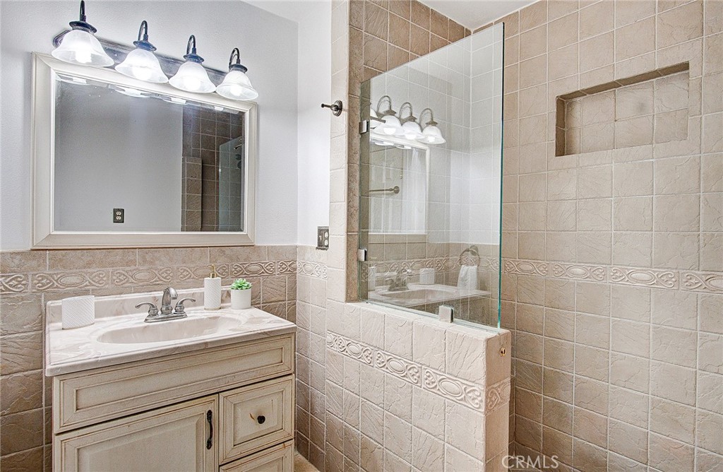 18329 Ambler Avenue Carson, CA 90746 - Photo 21 of 33 a bathroom with a sink vanity and mirror