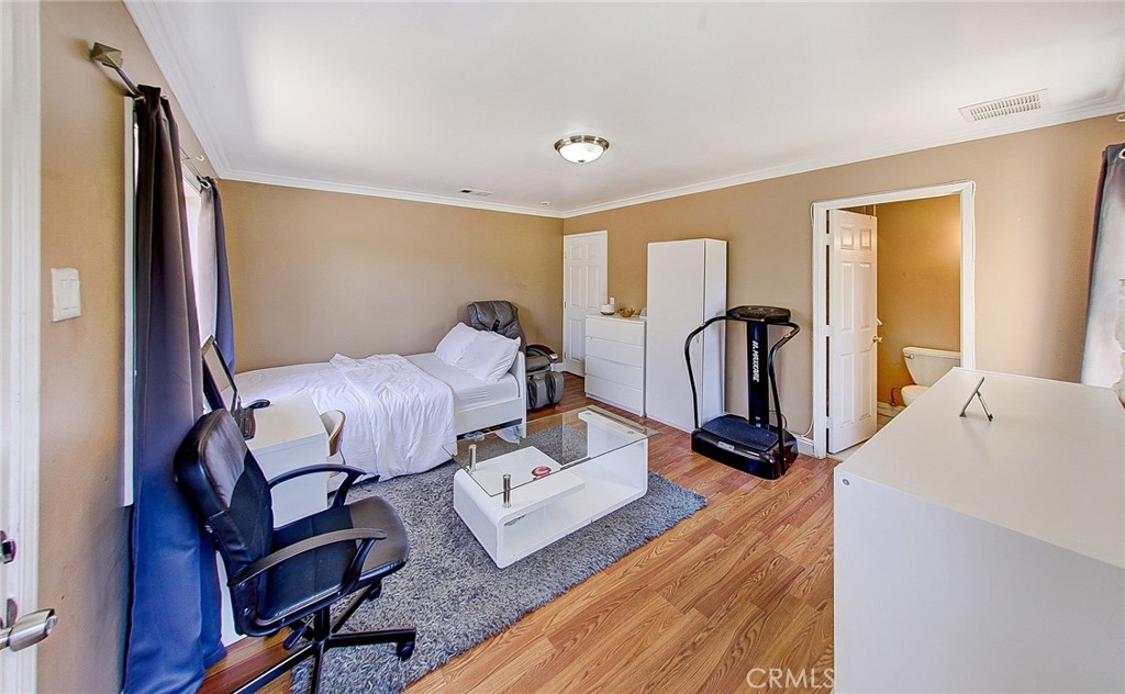 18329 Ambler Avenue Carson, CA 90746 - Photo 23 of 33 a bed room with a bed and a dresser