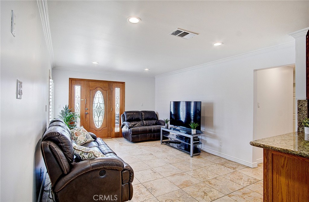 18329 Ambler Avenue Carson, CA 90746 - Photo 6 of 33 a living room with furniture window and a flat screen tv