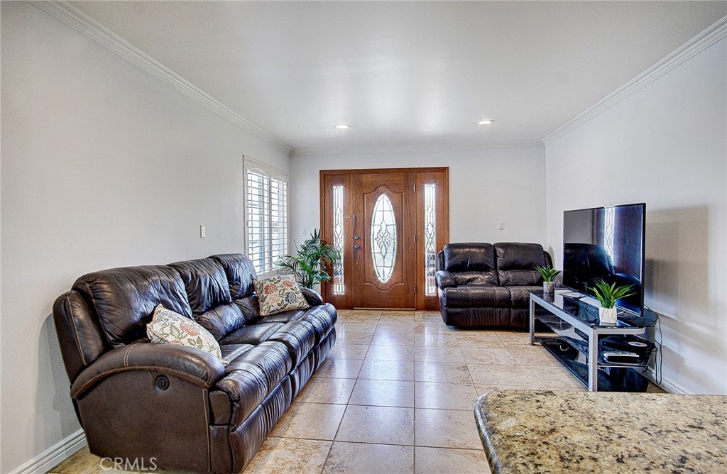 18329 Ambler Avenue Carson, CA 90746 - Photo 8 of 33 a living room with furniture and a flat screen tv