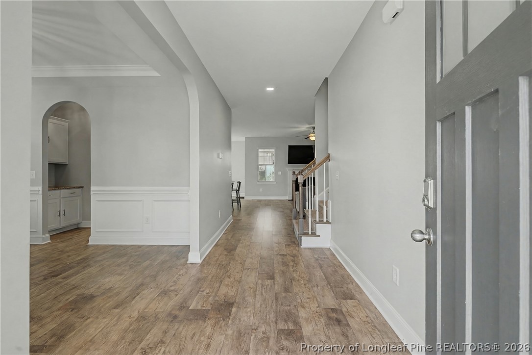 47 Pinnacle Drive Spring Lake, NC 28390 - Photo 6 of 50 a view of hallway with wooden floor and stairs