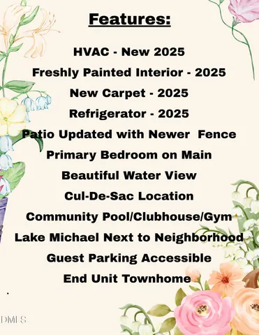 a bathroom with a large window and flowers