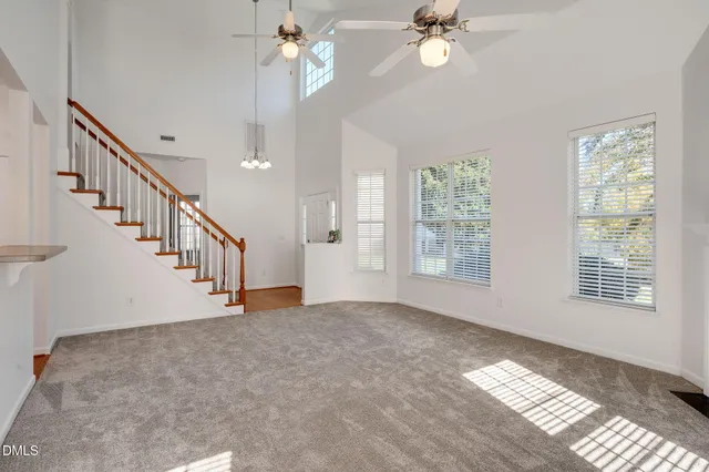 a view of a hallway with wooden floor and entryway