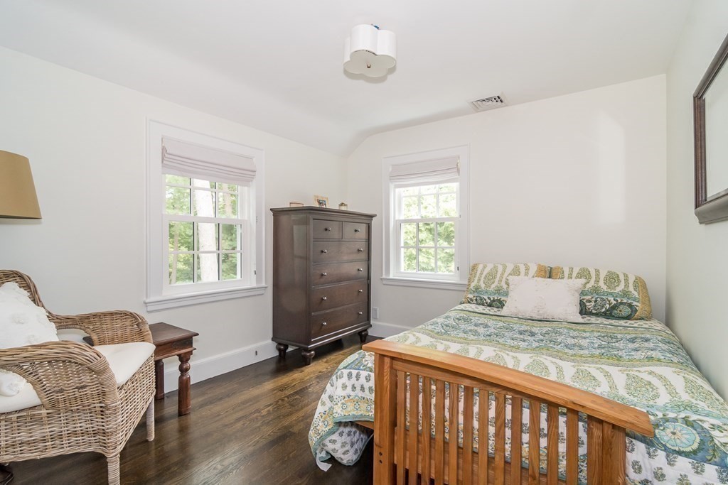 81 Parker Road Wellesley, MA 02482 - Photo 14 of 25 a bedroom with a bed and wooden floor
