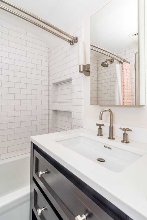 81 Parker Road Wellesley, MA 02482 - Photo 16 of 25 a bathroom with a sink and a bathtub