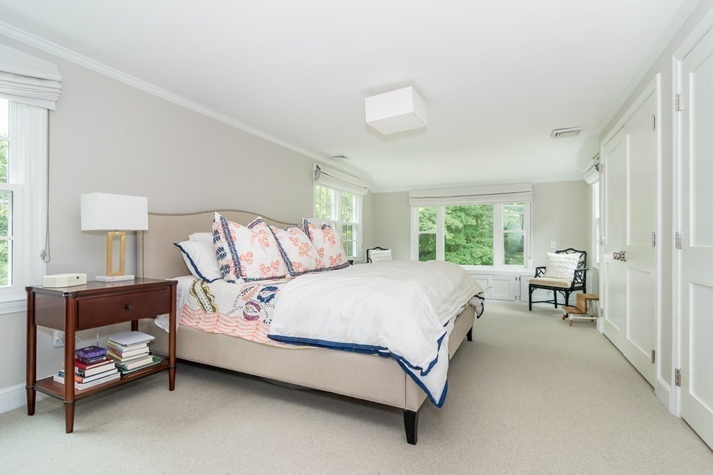 81 Parker Road Wellesley, MA 02482 - Photo 17 of 25 a bed room with a bed and a chair