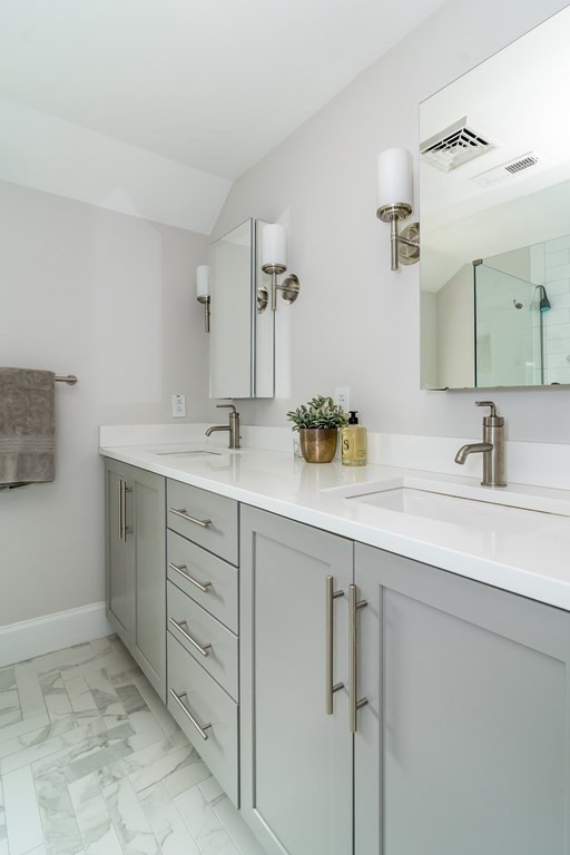 81 Parker Road Wellesley, MA 02482 - Photo 19 of 25 a bathroom with a sink and a mirror
