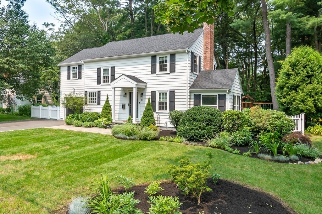 81 Parker Road Wellesley, MA 02482 - Photo 2 of 25 a front view of a house with a yard and potted plants