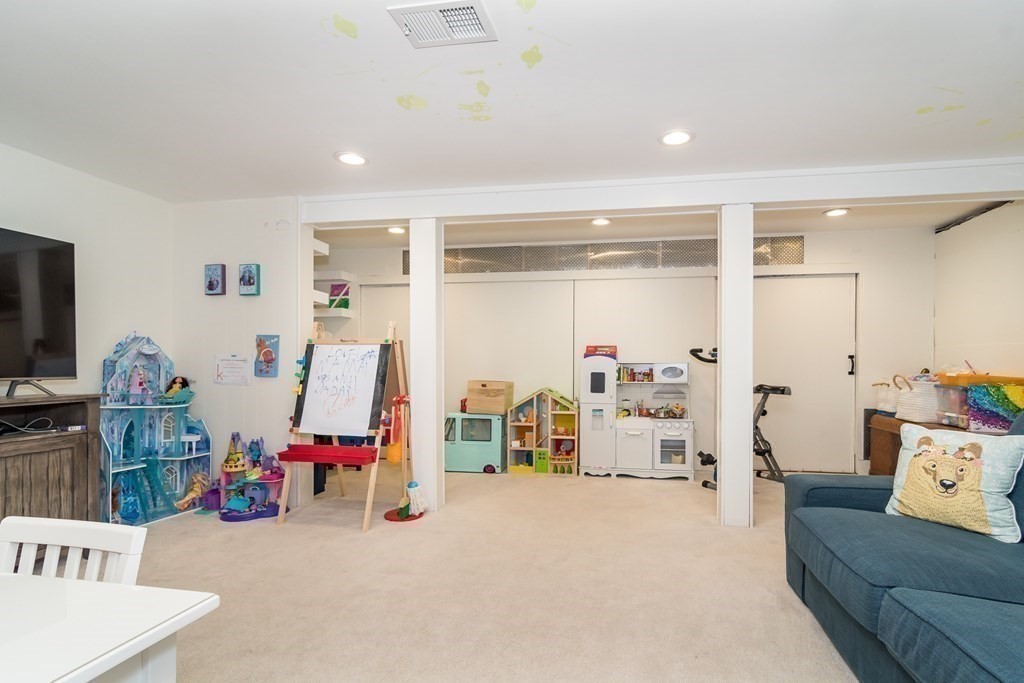 81 Parker Road Wellesley, MA 02482 - Photo 21 of 25 a view of a livingroom with furniture and hardwood floor