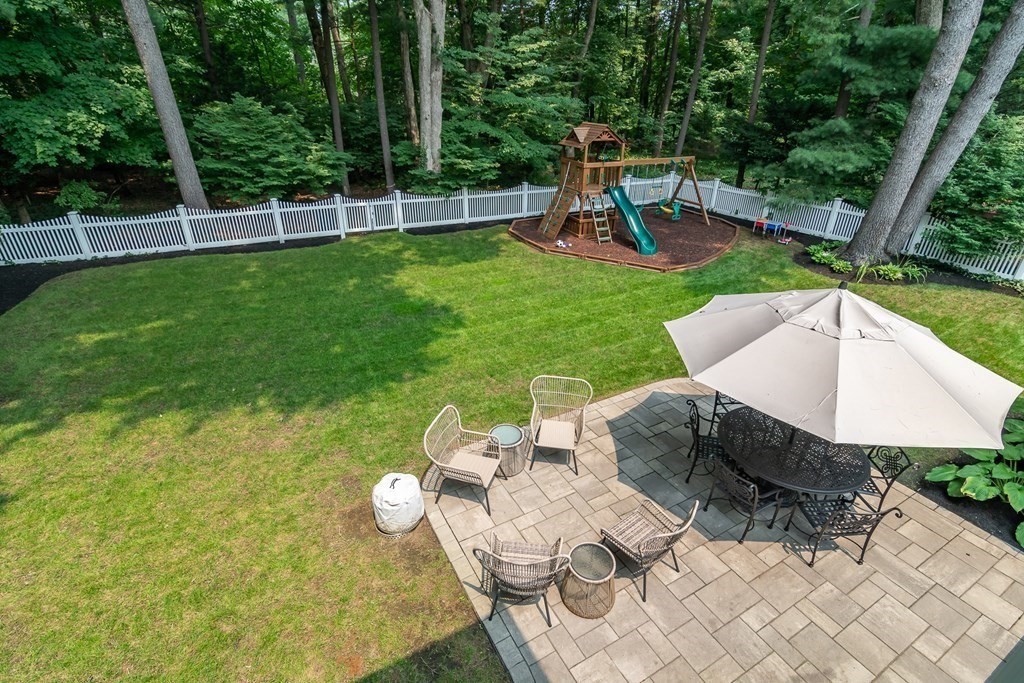 81 Parker Road Wellesley, MA 02482 - Photo 22 of 25 a view of backyard with seating area and green space
