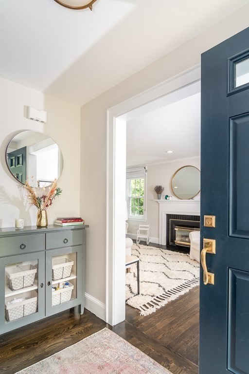81 Parker Road Wellesley, MA 02482 - Photo 3 of 25 a living room with furniture a fireplace and a table