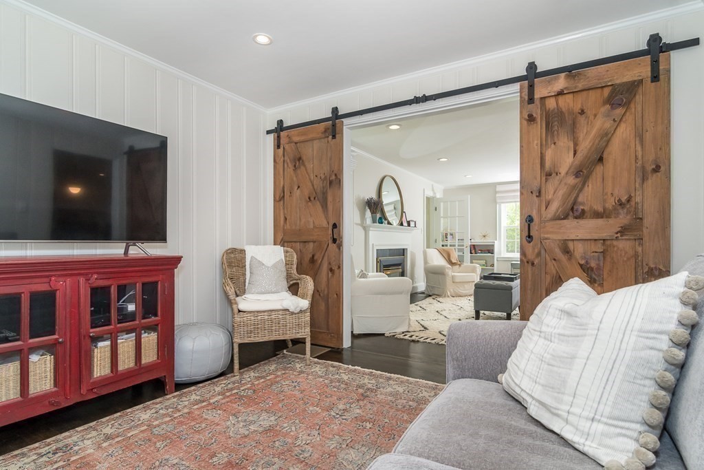 81 Parker Road Wellesley, MA 02482 - Photo 10 of 25 a living room with furniture and a flat screen tv