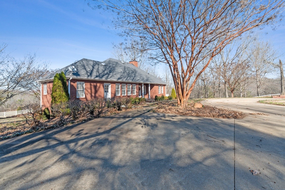 1787 Hagan Road Prospect, TN 38477 - Photo 49 of 57 a view of a yard with a house