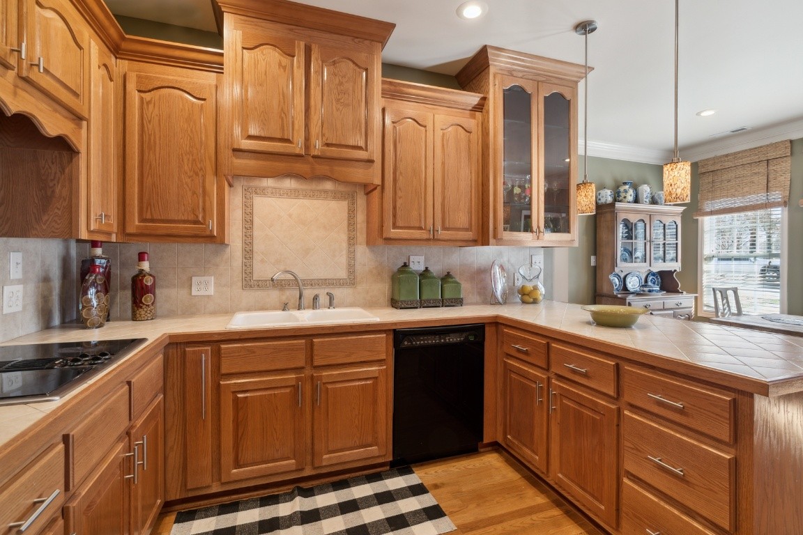 1787 Hagan Road Prospect, TN 38477 - Photo 8 of 57 a kitchen with stainless steel appliances granite countertop a sink and cabinets