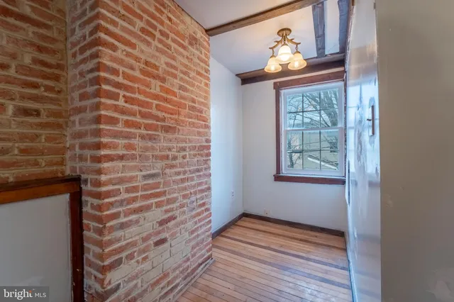 a view of entryway with wooden floor