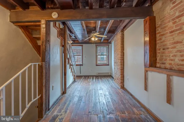 a view of entryway with wooden floor