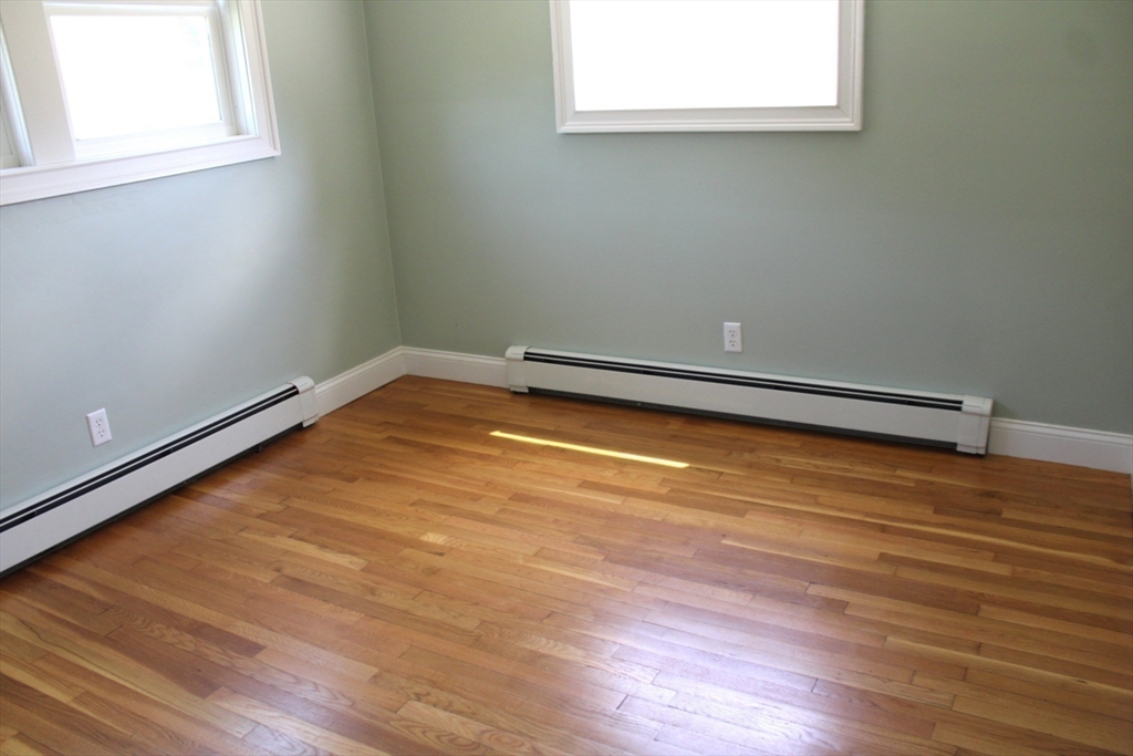 21 Whitcomb Drive Lancaster, MA 01523 - Photo 16 of 23 a room with a wooden floor and a window