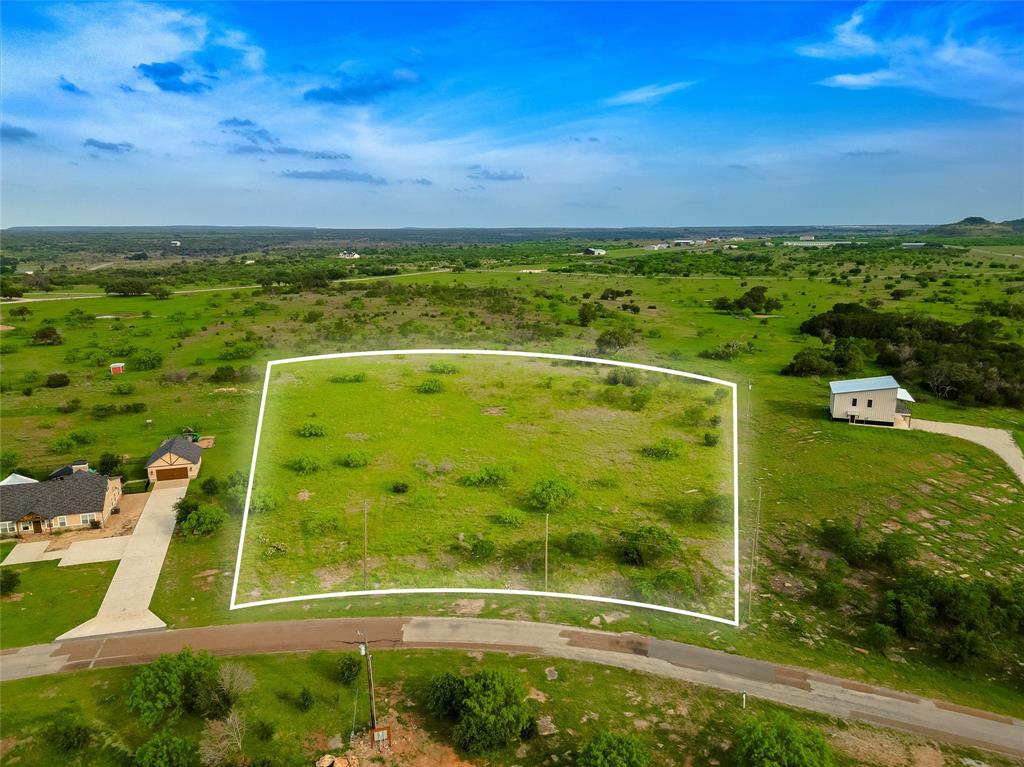 4-6 Hells Gate Loop Strawn, TX 76475 - Photo 2 of 13 a view of a swimming pool with an outdoor seating and yard