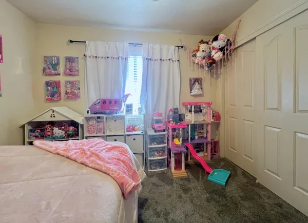 a bed room with a bed and a desk