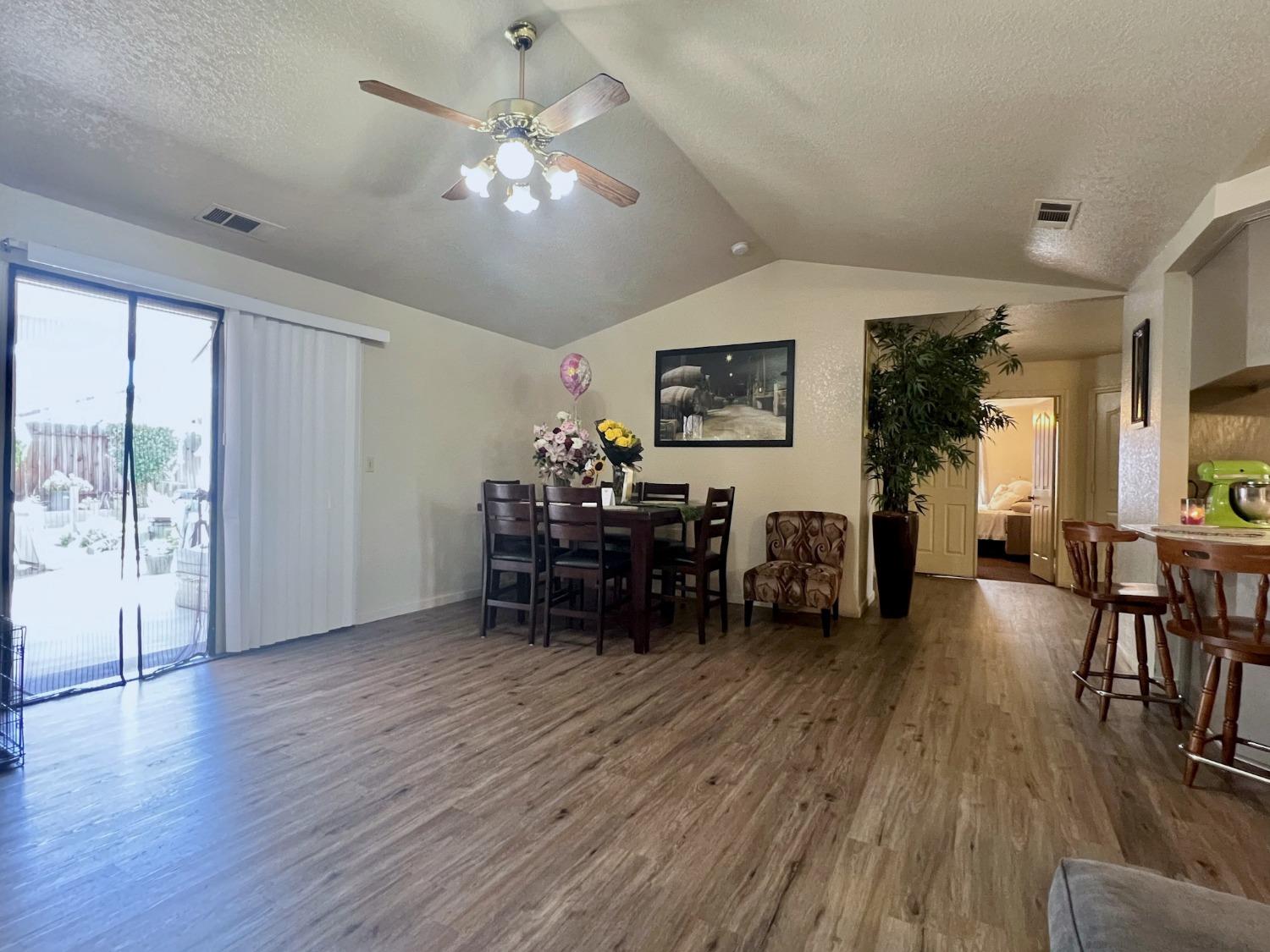 3116 Larrynell Drive Ceres, CA 95307 - Photo 9 of 32 a living room with furniture and wooden floor