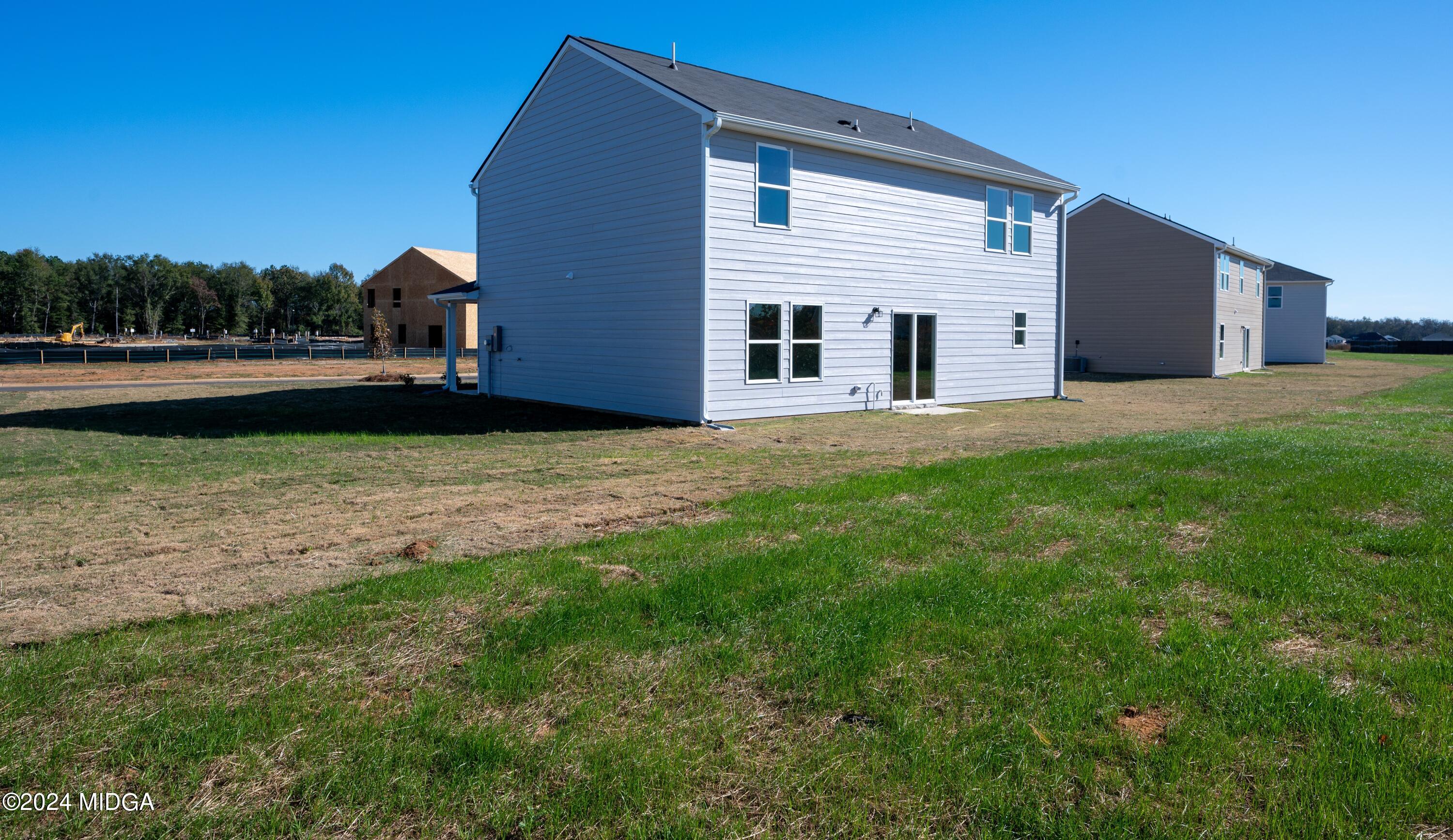 608 Leisure Pointe Road Macon, GA 31216 - Photo 6 of 19 a view of a house with backyard and garden