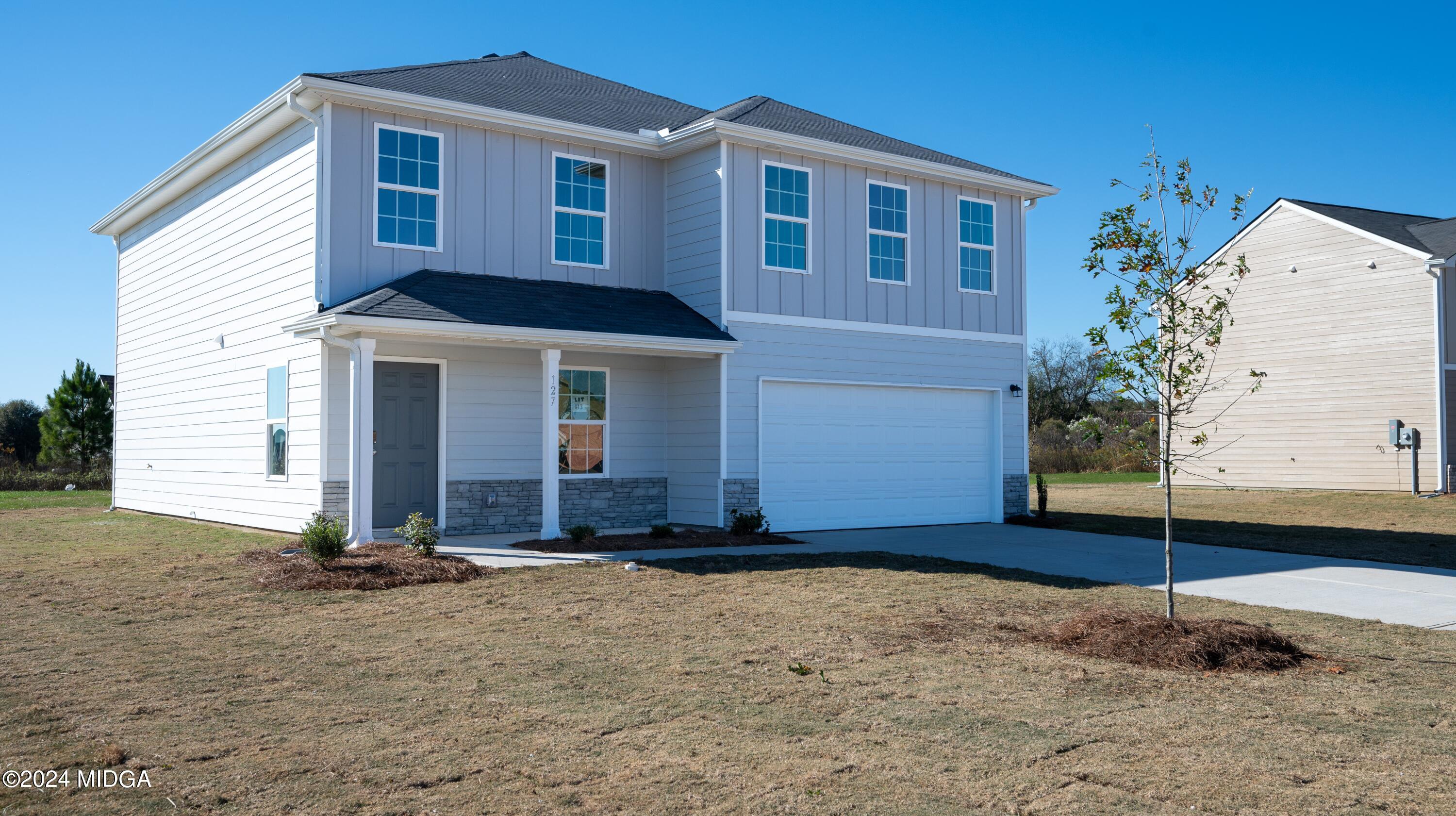 608 Leisure Pointe Road Macon, GA 31216 - Photo 8 of 19 a front view of a house with a yard