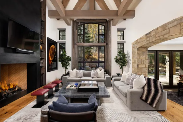 a living room with furniture fireplace and flat screen tv