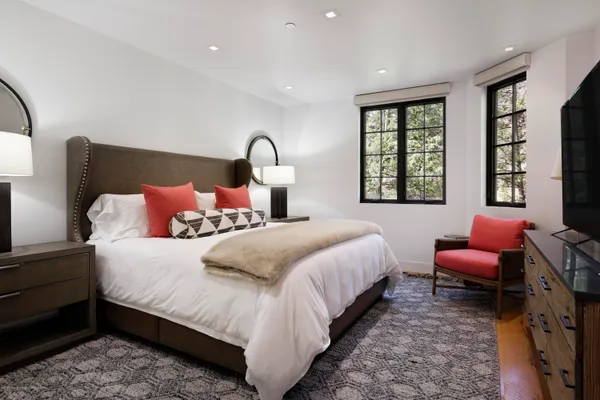 a bedroom with bed and a window