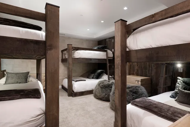 a bedroom with a bed and a mirror