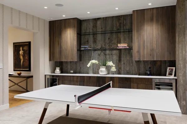 a kitchen with a table and chairs