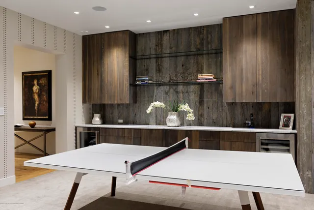 a kitchen with a table and chairs