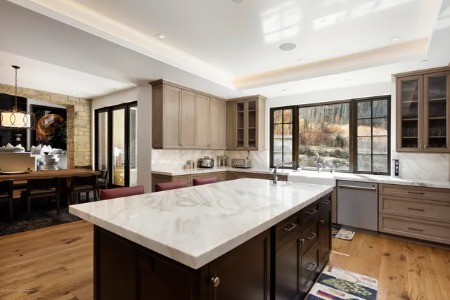 a kitchen with counter top space and sink