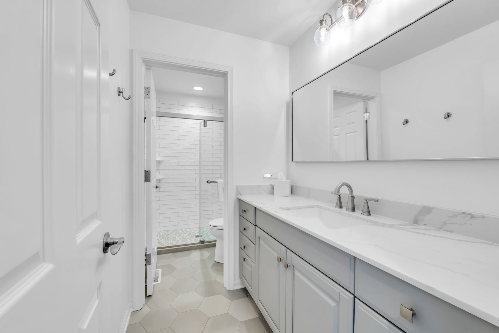 2500 Stonebridge Lane Northbrook, IL 60062 - Photo 11 of 11 a bathroom with a double vanity sink mirror and shower