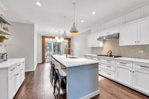a kitchen with a sink and cabinets