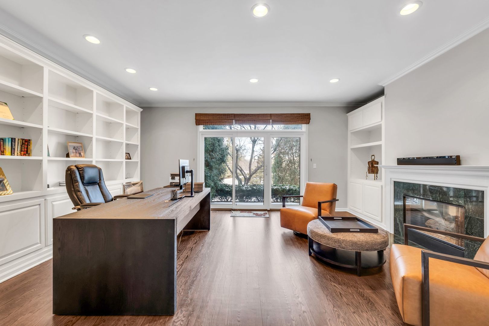 2500 Stonebridge Lane Northbrook, IL 60062 - Photo 8 of 11 a living room with furniture a fireplace and a large window