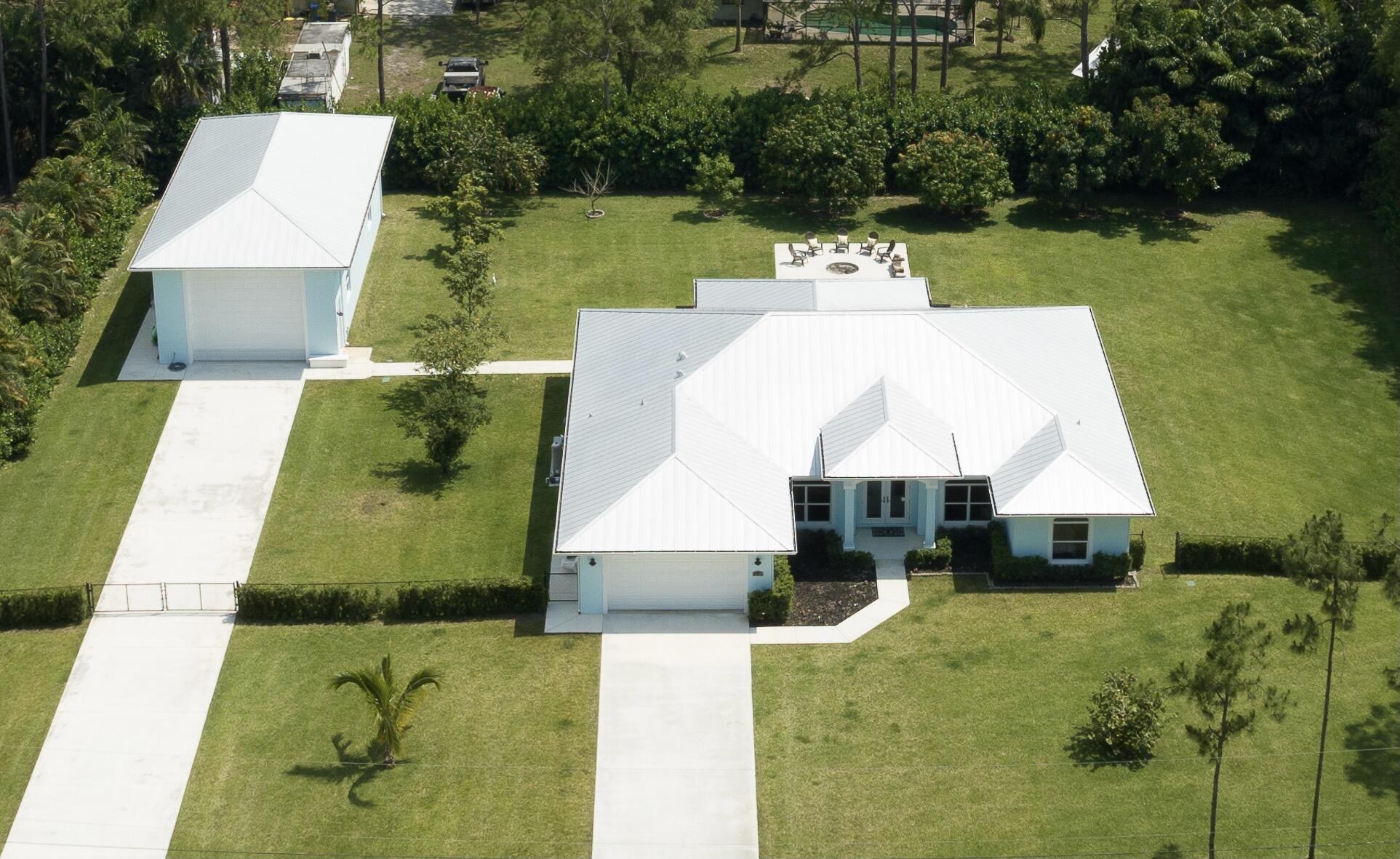 a aerial view of a house with swimming pool and patio