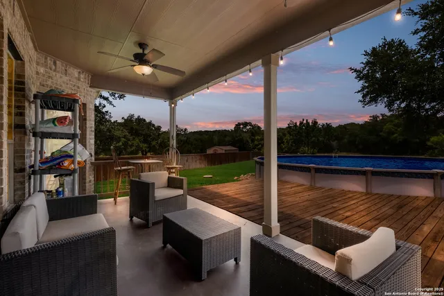 a view of swimming pool with a patio