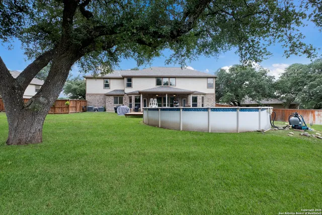 a view of a house with a yard porch and sitting area