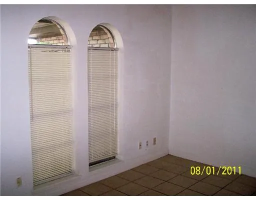 a view of front door with wooden floor
