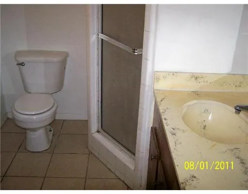 a bathroom with a toilet and a sink