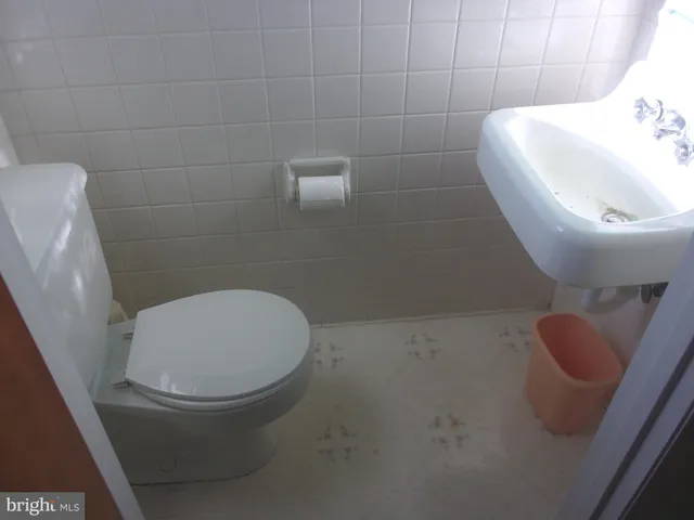 a bathroom with a toilet and a sink