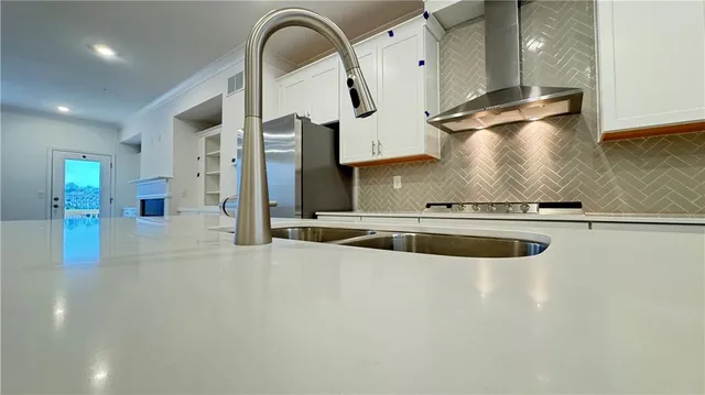 a view of water heater room with a sink