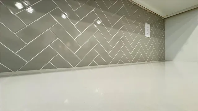 a bathroom with a toilet a sink and a window